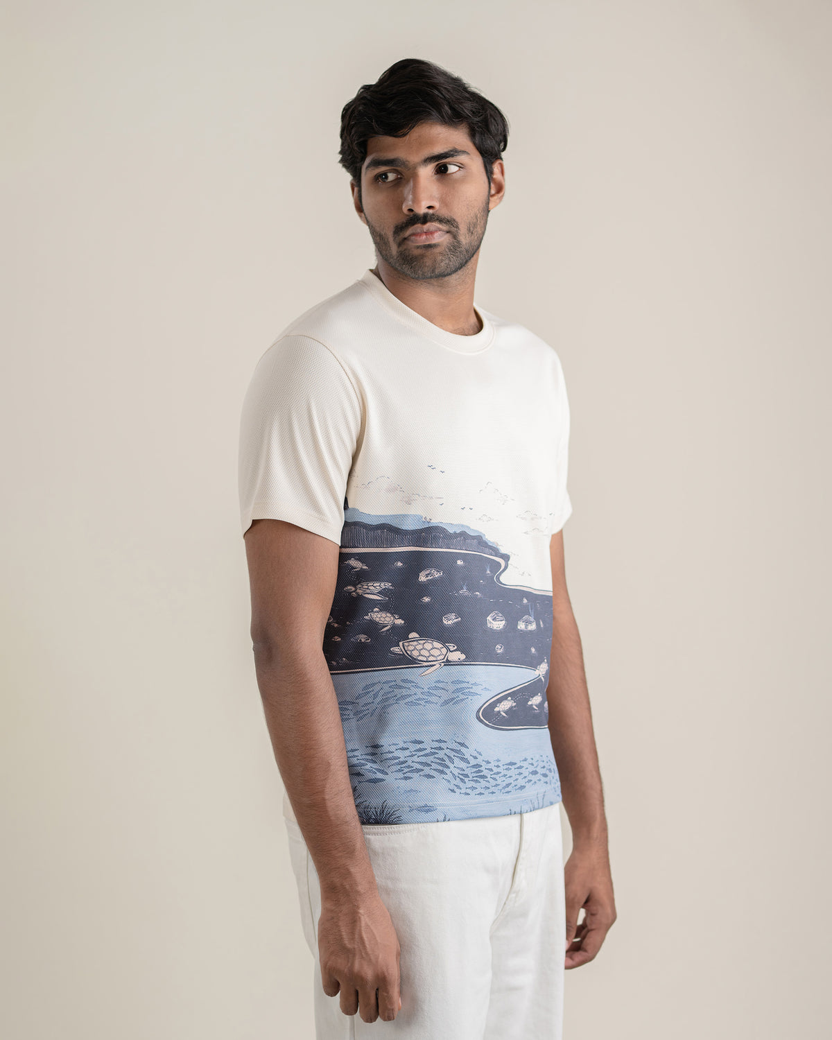 Side view of the Makara Tee showing the print across the body.