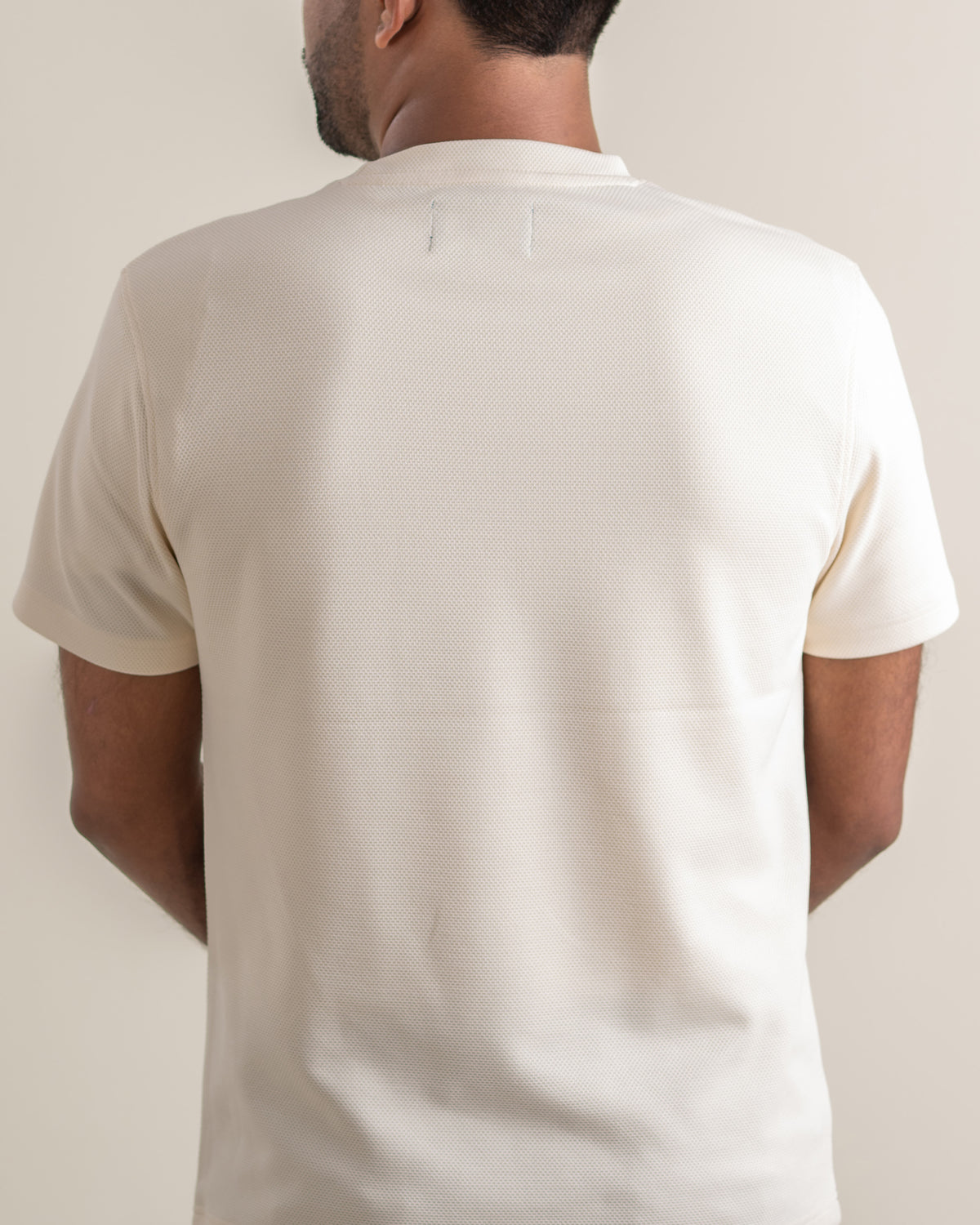 Back view of the Makara Tee in lunar knit.
