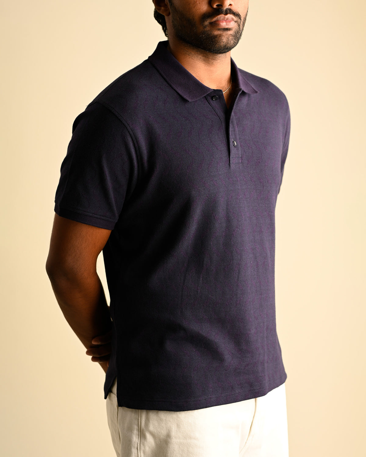 Close view of the Moiré Polo showing the jacquard surface.