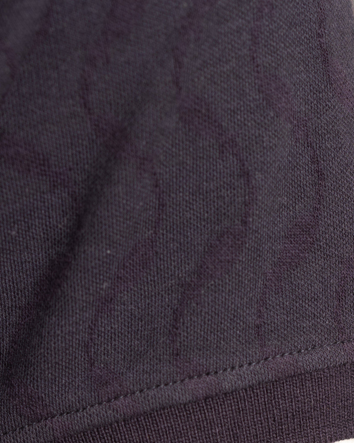 Close view of the jacquard knit fish on the Moiré Polo